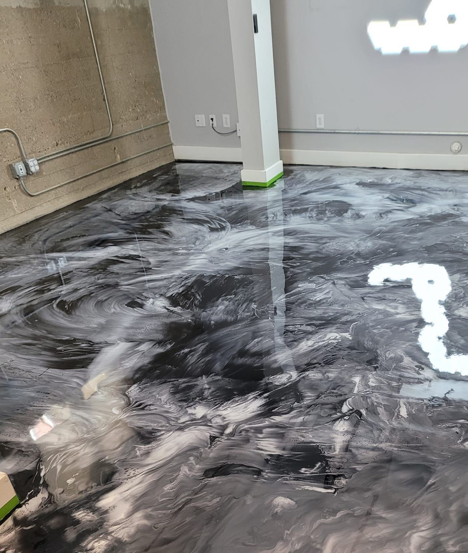 Silver and black metallic epoxy floor